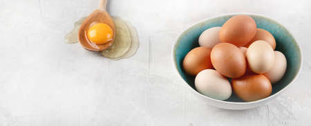 Fresh farm chicken eggs on grey background. . Panorama, banner  with copy space