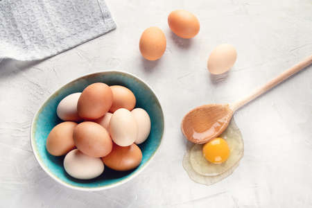 Fresh farm chicken eggs on grey background. Top view
