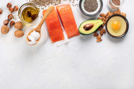 Selection of healthy fat sources. Healthy dieteating concept.Top view with copy spaceの写真素材