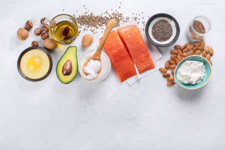 Selection of healthy fat sources. Healthy dieteating concept.Top view with copy spaceの写真素材