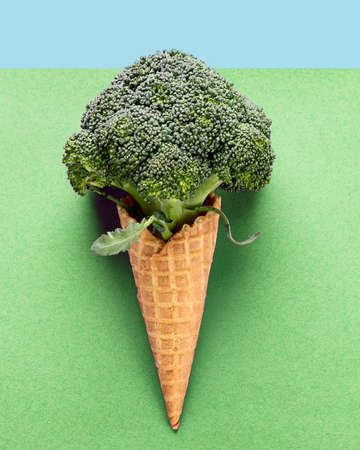 Healthy ice cream. Broccoli in waffle cone. Vegan and vegetarian diet concept. Top view