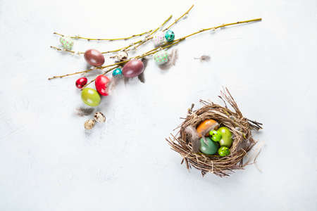 Easter eggs in bird nest. Happy Easter. Top view with copy space