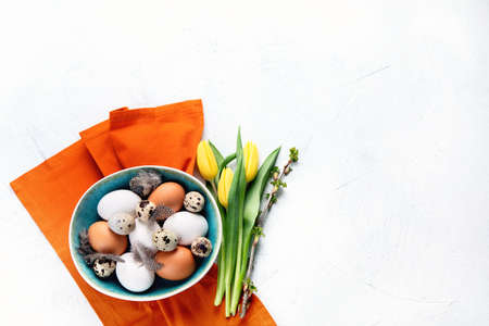 Fresh chicken and quail eggs. Top view with copy space