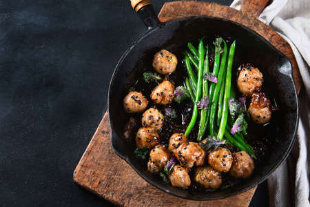 Asian Meatballs, green beans sauce  with sesame and soy sauce.