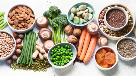 Food sources of plant based protein. Healthy diet with  legumes, dried fruit, seeds, nuts and...