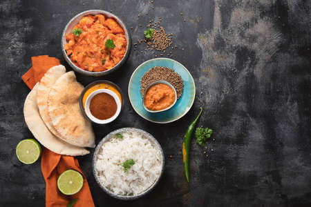 Indian Butter chicken, basmati rice, spices, naan bread.の写真素材