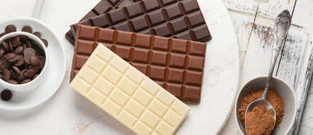 Dark bitter, milk and white chocolate,  cocoa butter, cacao powder and beans.の写真素材