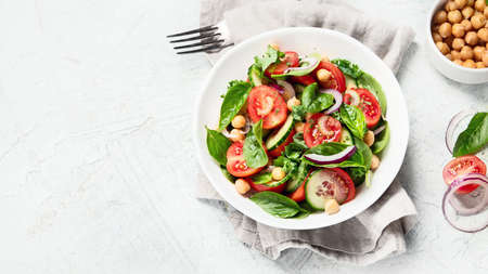 Healthy veggies salad,. Vegetable appetizer. Vegan and vegetarian diet menu. Clean and detox eating concept. Top view with copy spaceの写真素材