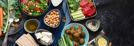 Vegetarian variety dishes on black background. Healthy vegan food. Clean food and eating concept....