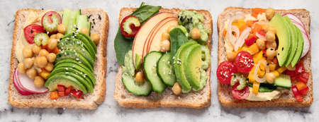 Vegetable sandwiches. Plant-based diet. Vegetarian healthy food concept. Clean eating. Top view....
