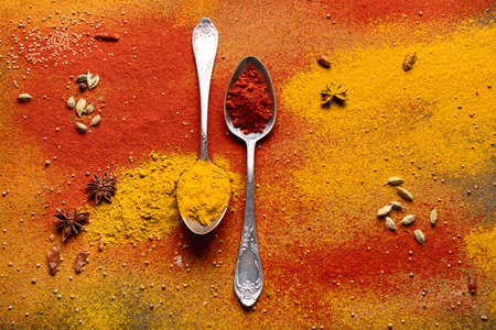 Colorful spices for cooking. Indian spices background. Top view