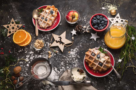 Christmas breakfast with waffles. Top view, flat layの写真素材