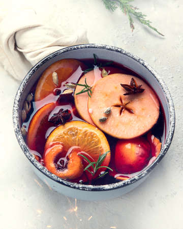 Mulled wine  with spices, apples and citrus fruit. Traditional Christmas hot drink. Top viewの写真素材