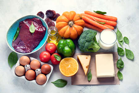 Foods high in vitamin A (Retinol). Protects eyes from blindness;  supports bone health; supports a healthy immune system;  Top viewの写真素材