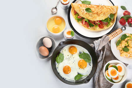Cooked egg dishes for breakfast. Tradidional Ways to Cook an Egg. Top view with copy spaceの写真素材