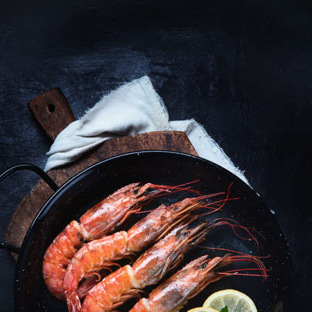 Roasted  prawn  shrimps on black background.  Top view with copy spaceの写真素材