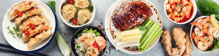 Assorted Chinese dishes on greyの写真素材