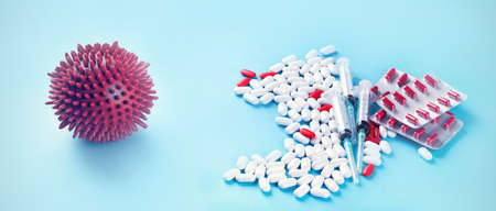 Coronavirus and drugs on blue background. Panorama, banner