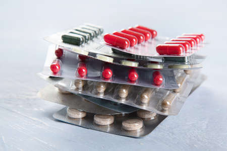 Heap of various Pharmaceutical medicine pills, tablets and capsules.