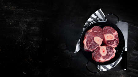 Ossobuco Veal shank on  black background. Top view with copy spaceの写真素材