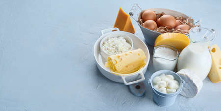 Different types of fresh farm dairy products. Foods rich in Calcium. Top view with copy spaceの写真素材