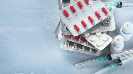 Heap of various Pharmaceutical medicine pills, tablets and capsules. Medical concept. Top view with copy spaceの写真素材