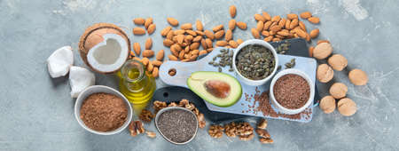 Foods high in plantbased fats. Alternative oils concept. Vegan and vegetarian fats. Top view, panorama, bannerの写真素材