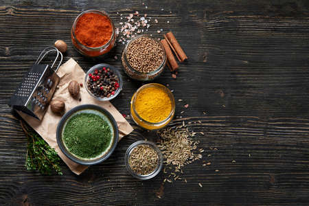 Various spices for cooking on rustic wooden background. Top view with copy spaceの写真素材