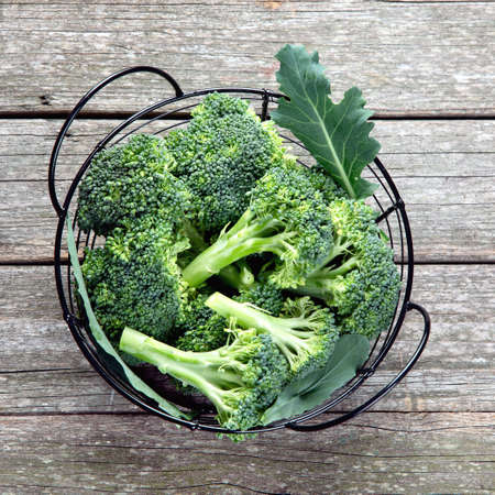 Raw cauliflower and broccoli on wooden rustic table. Delicious fresh vegetables. The concept of healthy food. Top view, flat layの写真素材