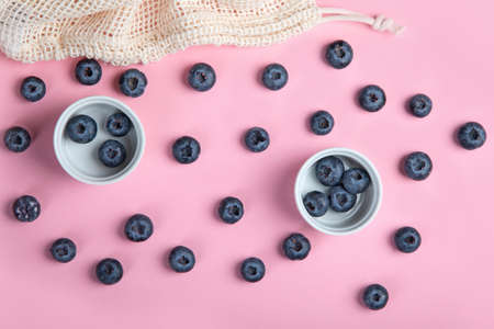 Fresh blueberries on pink background. Seasonal berry. Top view, copyspaceの写真素材