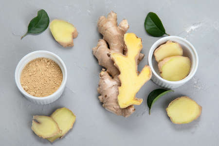 Fresh ginger root and ginger powder. Top view