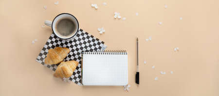 Morning cup of coffee, empty notebook, snacks and hydrangea flowers. Top view, flat lay. Panorama,...