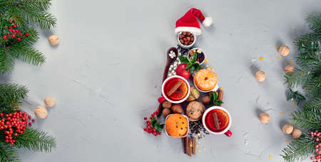 Christmas Tree made of holiday food on concrete background. Top view, flat lay. Christmas concept. New Year Holidays background.の写真素材
