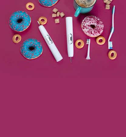 Variety of manual and electric toothbrushes. Healthy and unhealthy food. Dental Care Concept. Top...