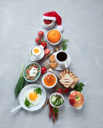 Christmas tree made of breakfast menu on light gray background. Top viewの写真素材