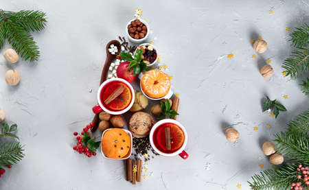 Christmas Tree made of holiday food on concrete background. Top view, flat lay. Christmas concept. New Year Holidays background.の写真素材