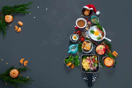 Christmas tree made of breakfast menu on gray background. Top view, Copy space