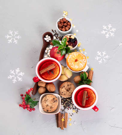 Christmas Tree made of holiday food on concrete background. Top view, flat lay. Christmas concept. New Year Holidays background.の写真素材