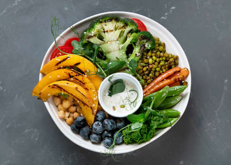 Buddha bowl of mixed grilled vegetables and legumes. Healthy eating concept. Top view, copy spaceの写真素材