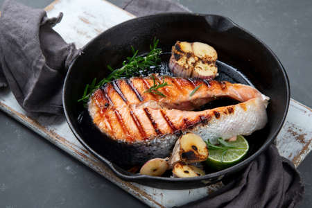 Salmon steak in a grill pan. Balanced diet.