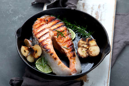Salmon steak in a grill pan. Balanced diet.の写真素材