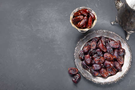 The meal eaten by Muslims after sunset during Ramadan on gray background. Arabic food concept. Top,...