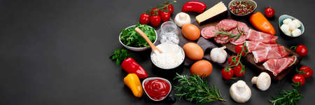 Italian pizza preparation. Variety of traditional cooking ingredients. Homemade delicious recipe...