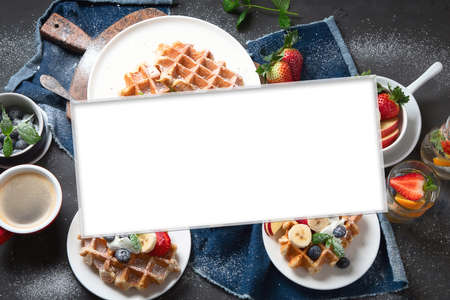 Collage of traditional belgian waffles with fresh berries and fruits for breakfast.の写真素材