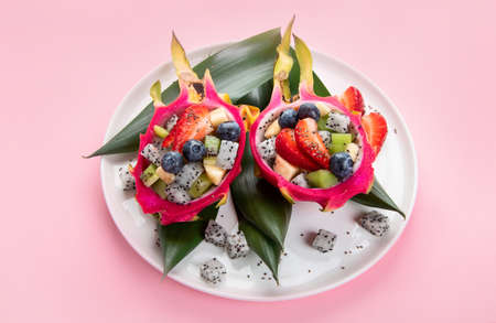 Tropical dragon fruit on colorful background. Minimalism design concept.の写真素材