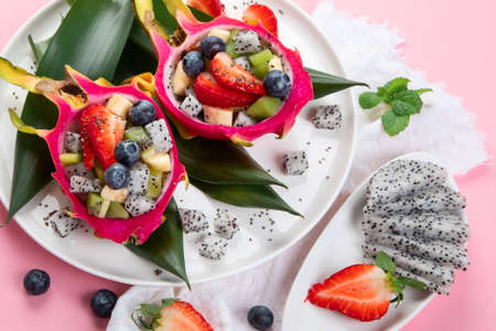 Tropical dragon fruit on colorful background. Minimalism design concept.の写真素材