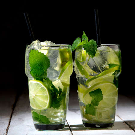 Fresh made Mojito cocktail on dark background. Summer drinks concept. Front viewの写真素材