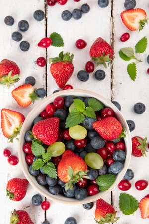 Various fresh forest berries on white background. Organic food concept. Top viewの写真素材