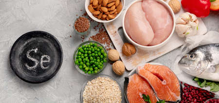 Food high in selenium on light gray background. Healthy eating concept. Top view, flat lay, copy spaceの写真素材