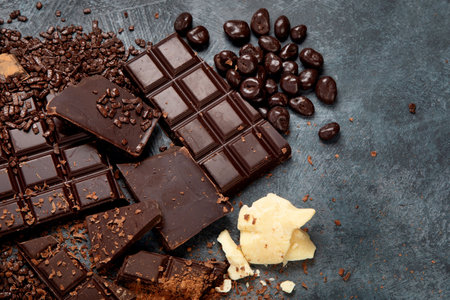 Cacao beans and chocolate on gray background. Top view, flat lay, copy spaceの写真素材